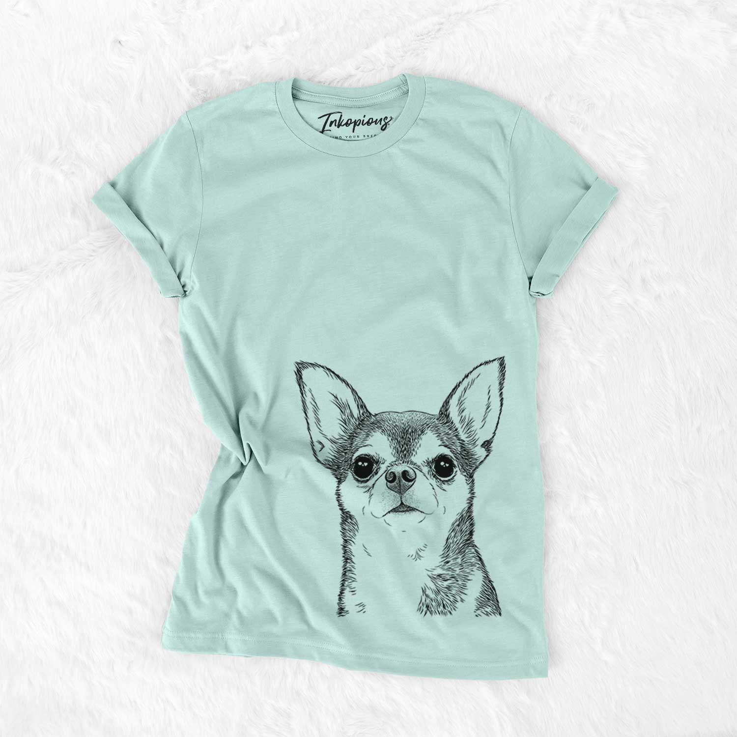 Hand-drawn sketch of Baby the Chihuahua on a Heather Sage Unisex crewneck