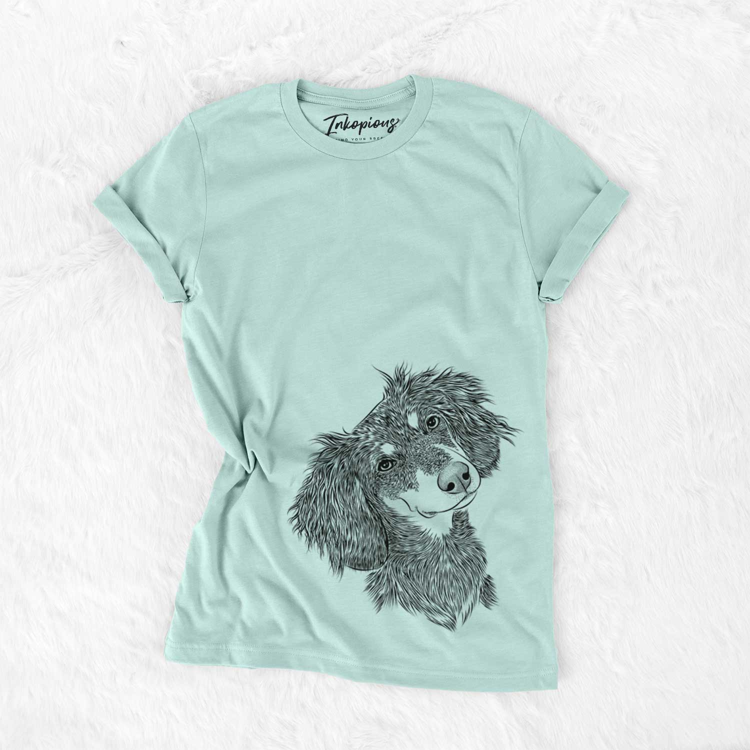 Hand-drawn sketch of Bailey the Long Haired Dachshund on a Heather Sage Bella Canvas Unisex Crewneck
