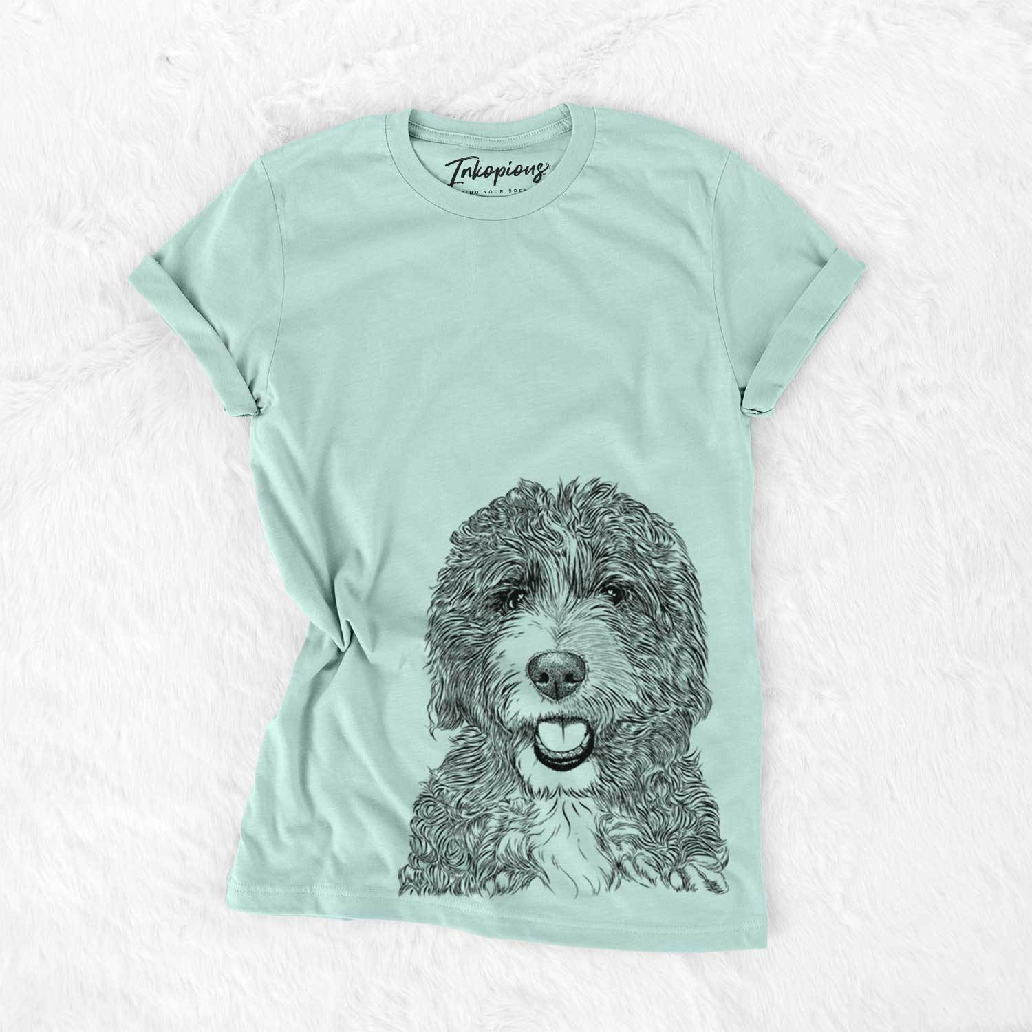Hand-drawn sketch of Bash the Bernedoodle on a Heather Sage Unisex crewneck