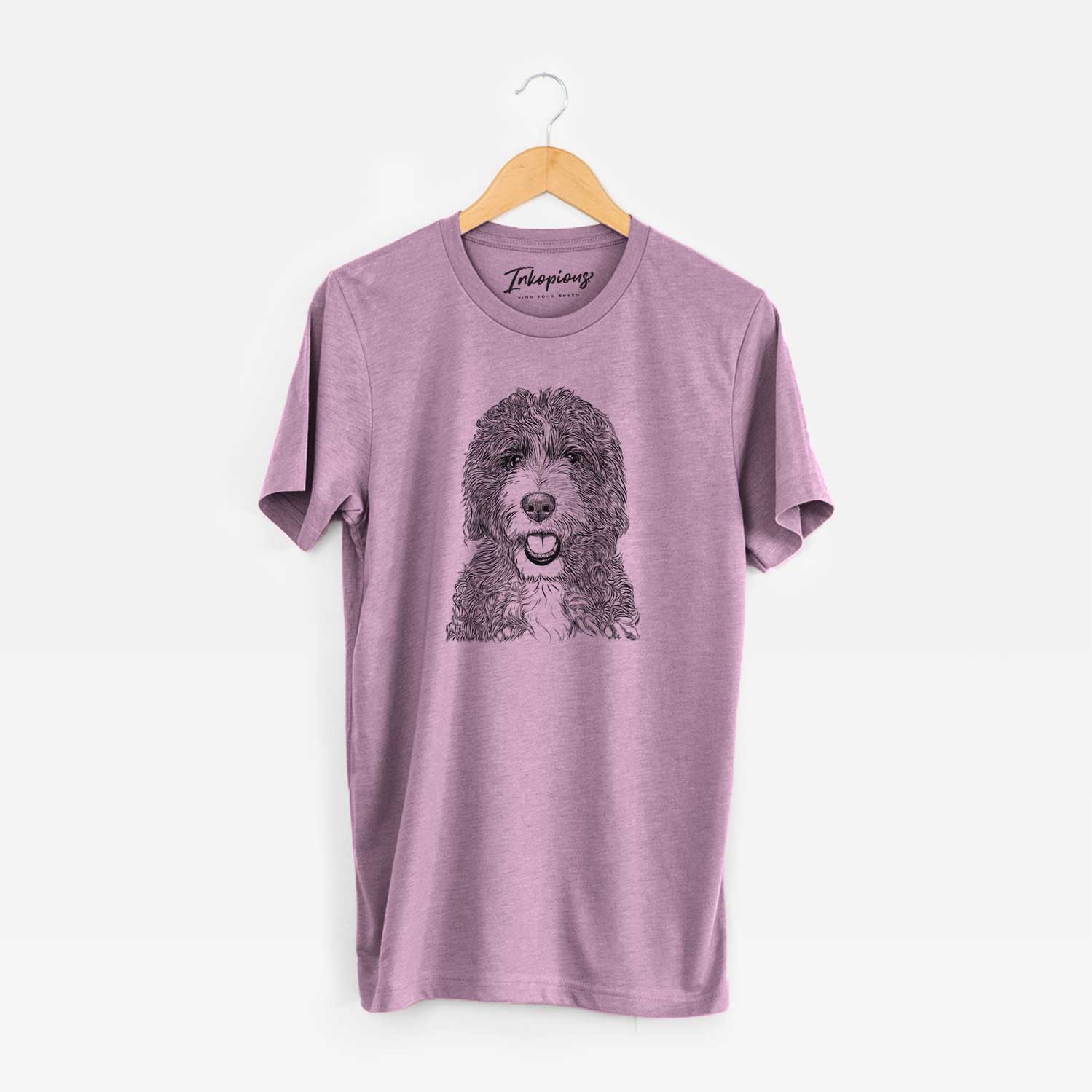 Hand-drawn sketch of Bash the Bernedoodle on an Orchid Unisex crewneck