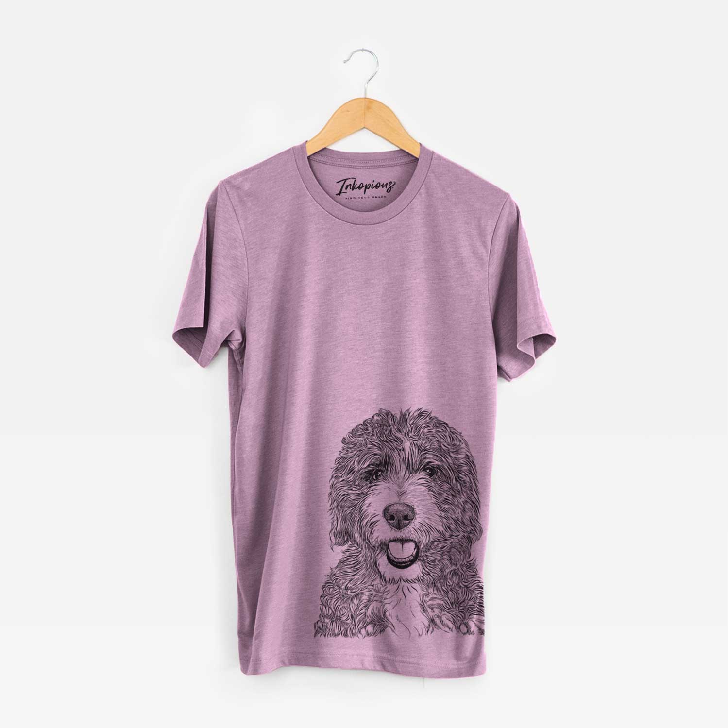 Hand-drawn sketch of Bash the Bernedoodle on an Orchid Unisex crewneck