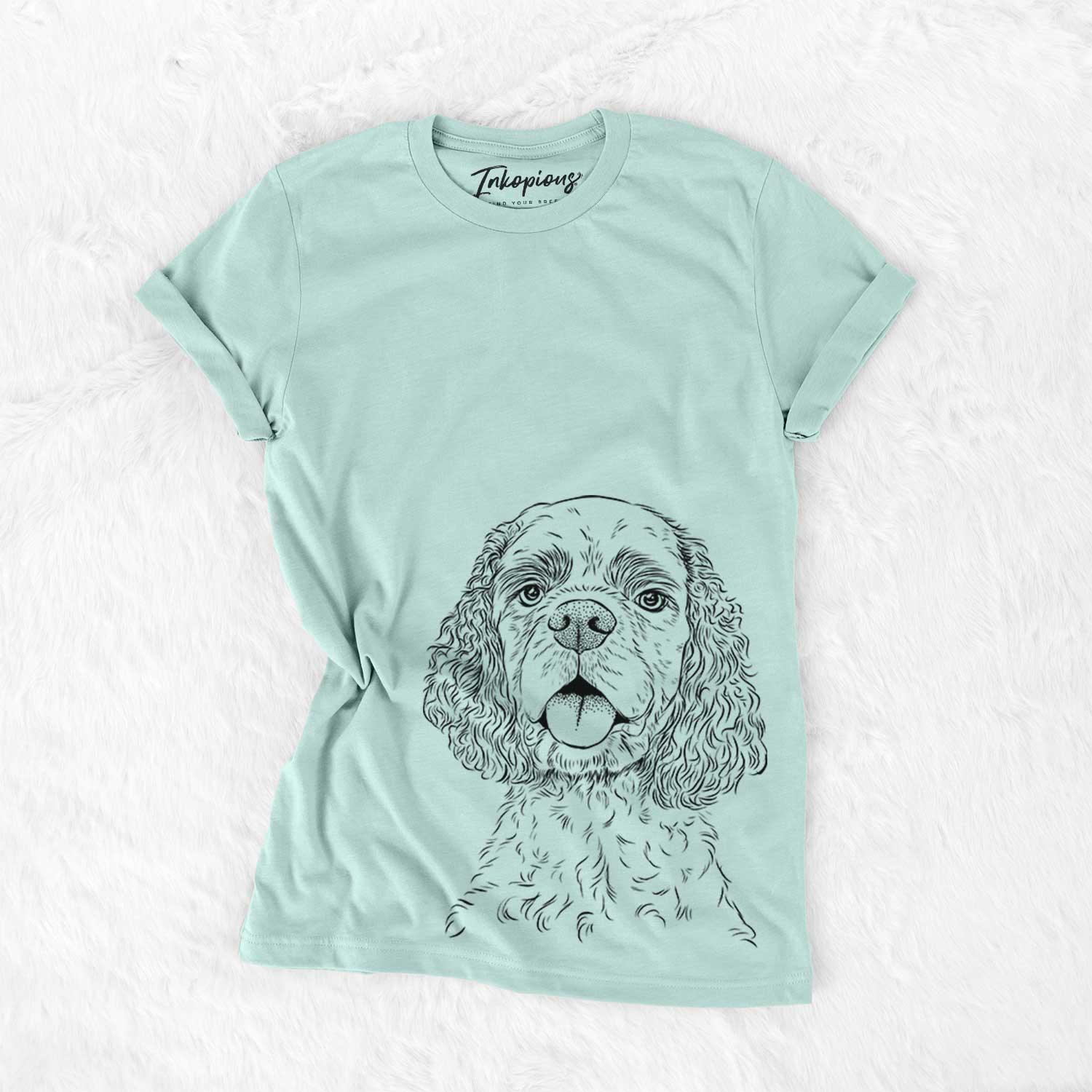 Hand-drawn sketch of Baxter the American Cocker Spaniel on a Heather Sage Bella Canvas Unisex Crewneck