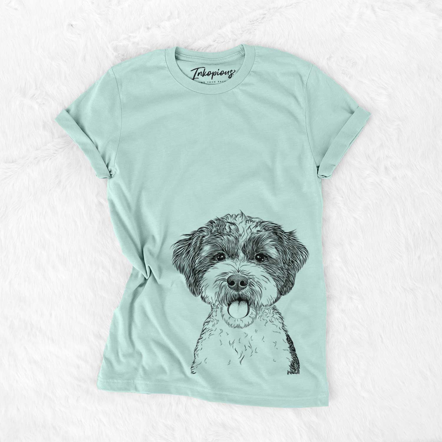 Hand-drawn sketch of Bella the Cockapoo on a Heather Sage Bella Canvas Unisex Crewneck