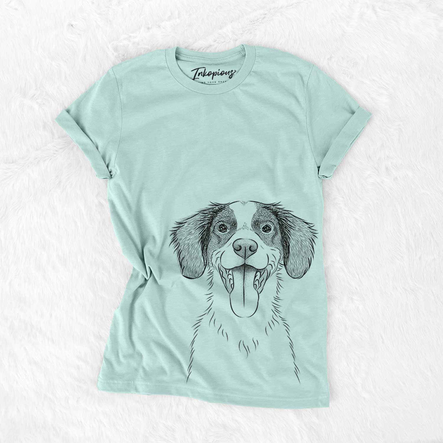 Hand-drawn sketch of Birdie the Brittany on a Heather Sage Bella Canvas Unisex Crewneck