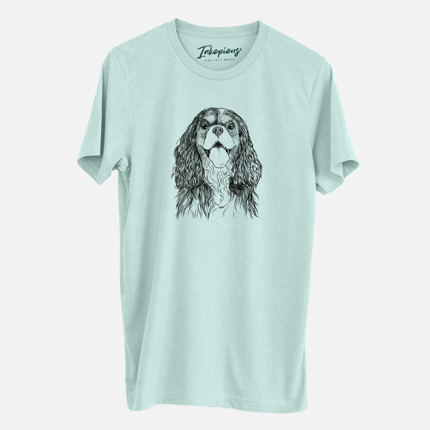 Hand-drawn sketch of Brandy the Cavalier King Charles Spaniel on a Heather Sage Unisex crewneck