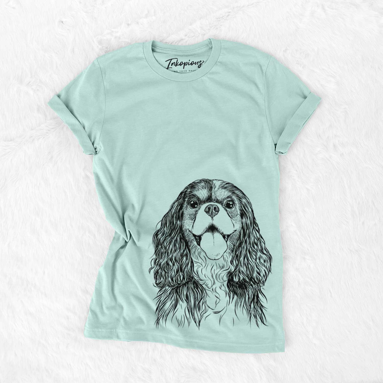 Hand-drawn sketch of Brandy the Cavalier King Charles Spaniel on a Heather Sage Unisex crewneck