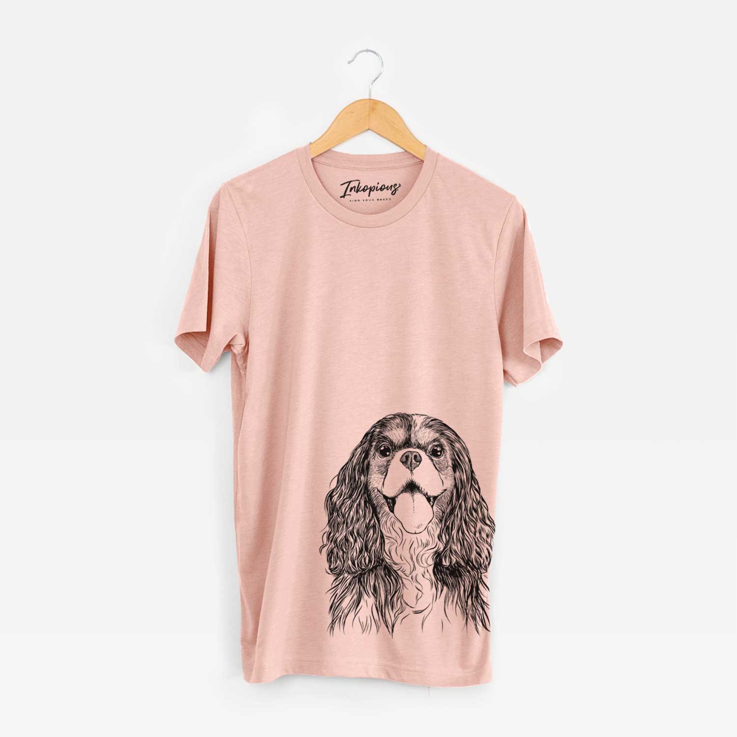 Hand-drawn sketch of Brandy the Cavalier King Charles Spaniel on a Peach Unisex crewneck