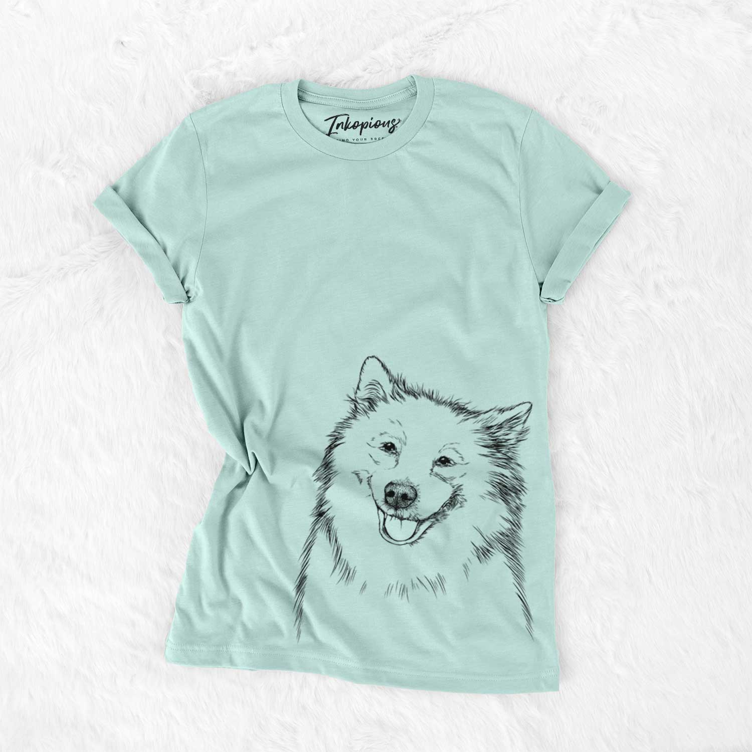 Hand-drawn sketch of Caico the Samoyed on a Heather Sage Unisex crewneck