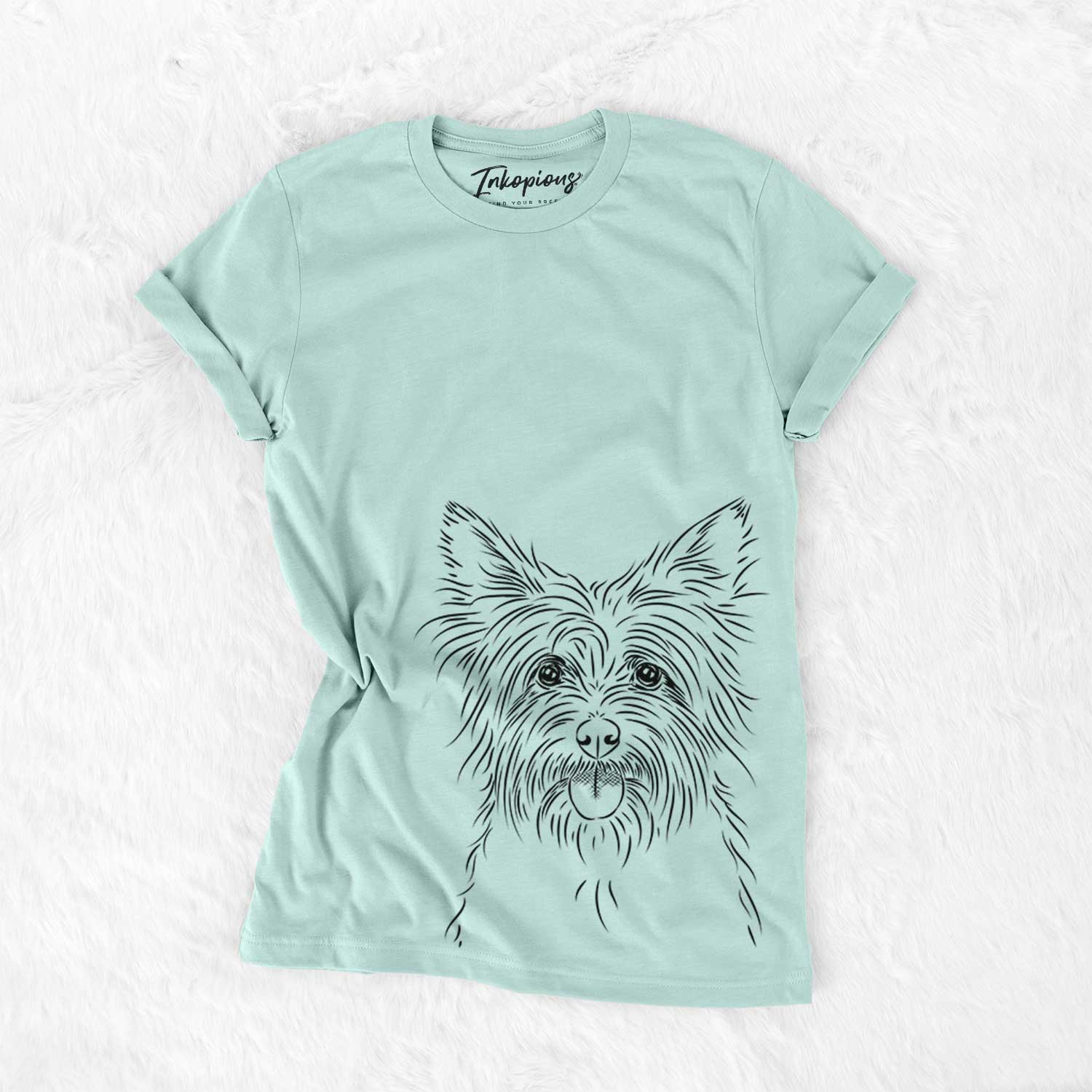 Hand-drawn sketch of Calum the Cairn Terrier on a Heather Sage Bella Canvas Unisex Crewneck