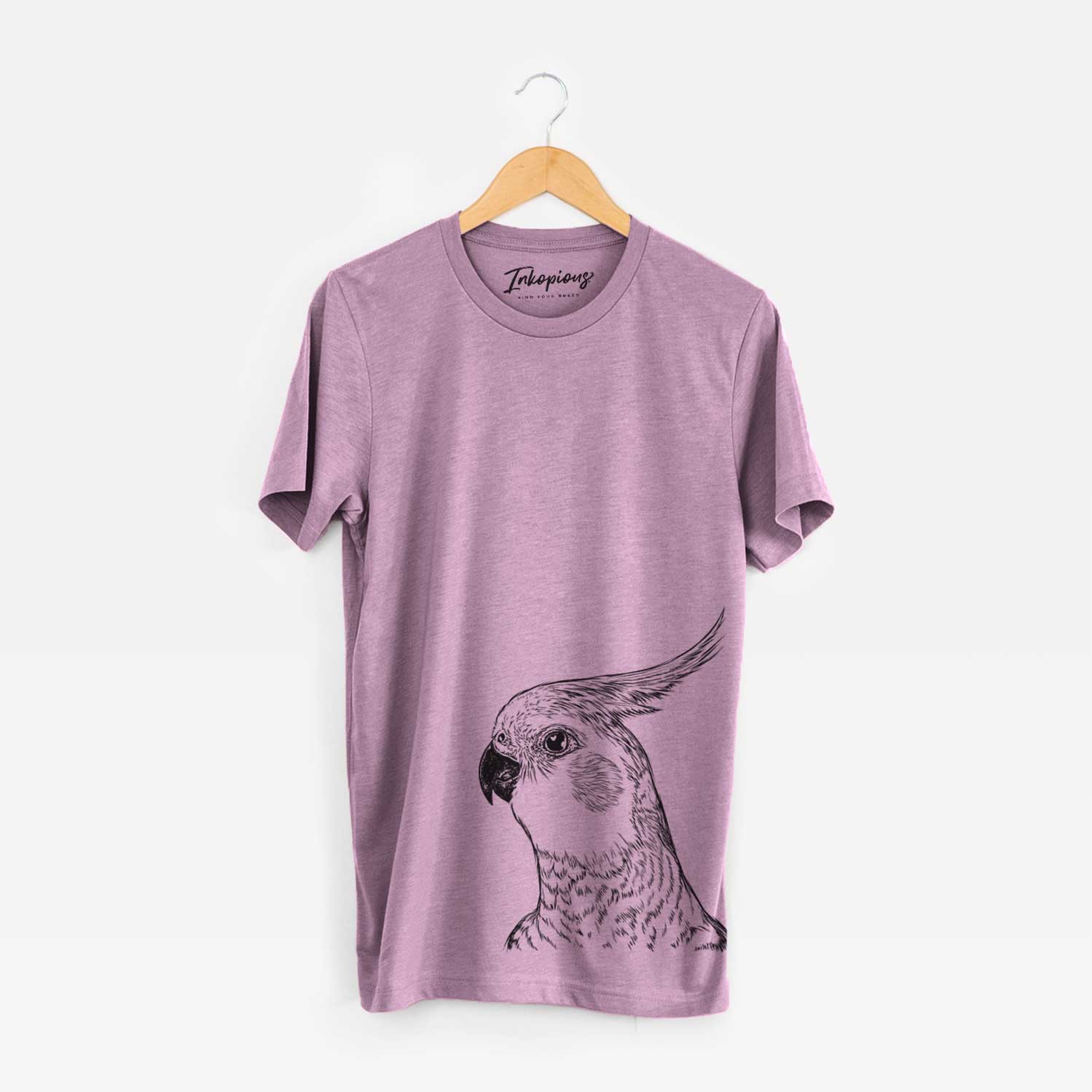 Hand-drawn sketch of Candy the Cockatiel on an Orchid Bella Canvas Unisex Crewneck