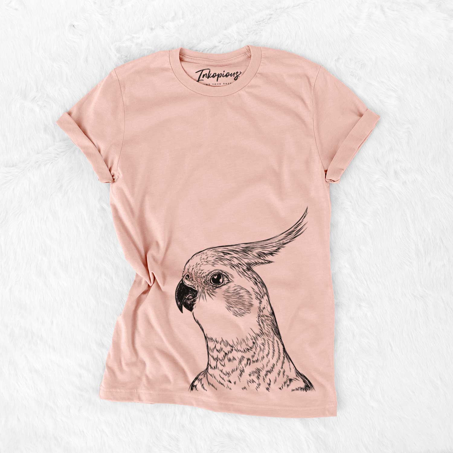 Hand-drawn sketch of Candy the Cockatiel on a Peach Bella Canvas Unisex Crewneck
