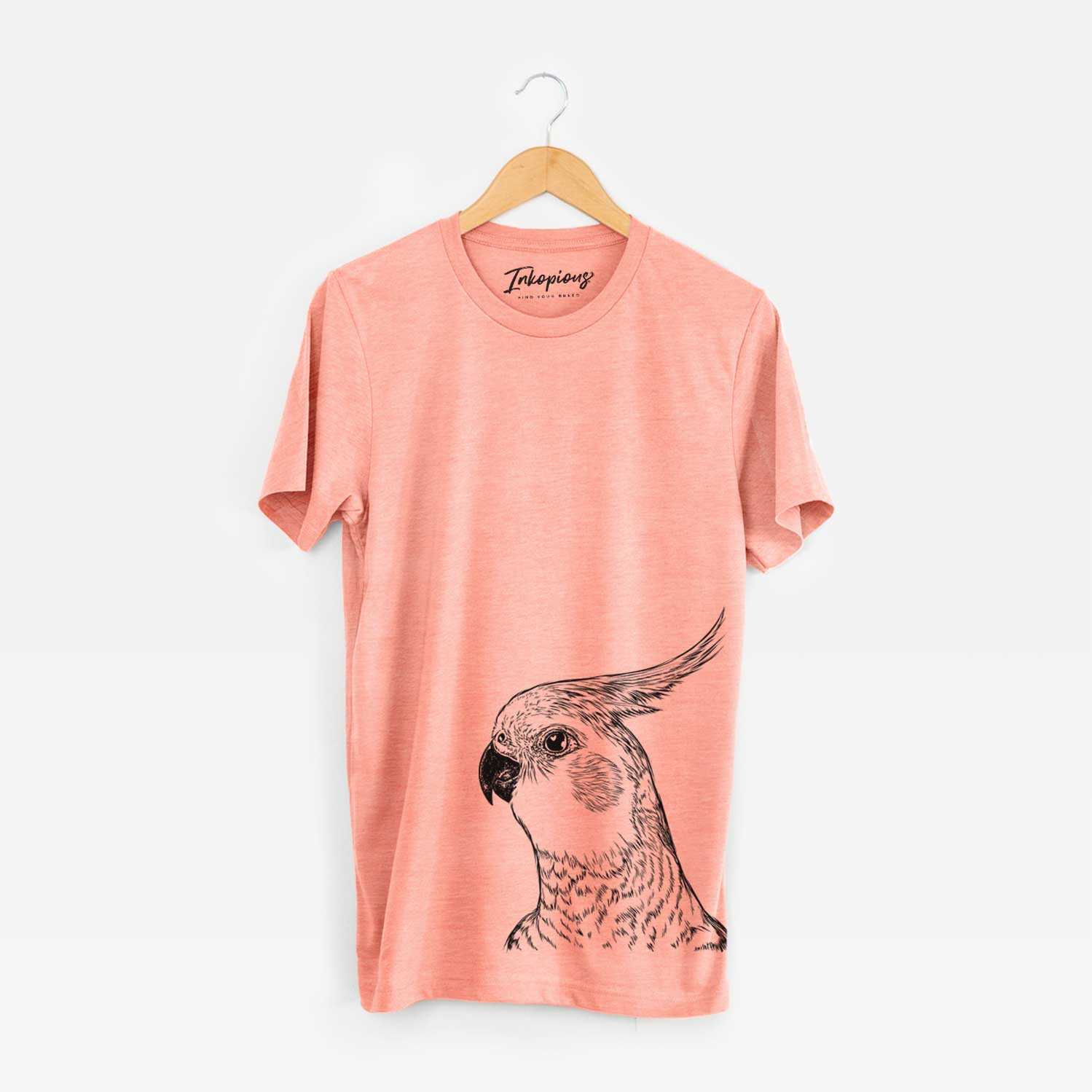 Hand-drawn sketch of Candy the Cockatiel on a Sunset Bella Canvas Unisex Crewneck