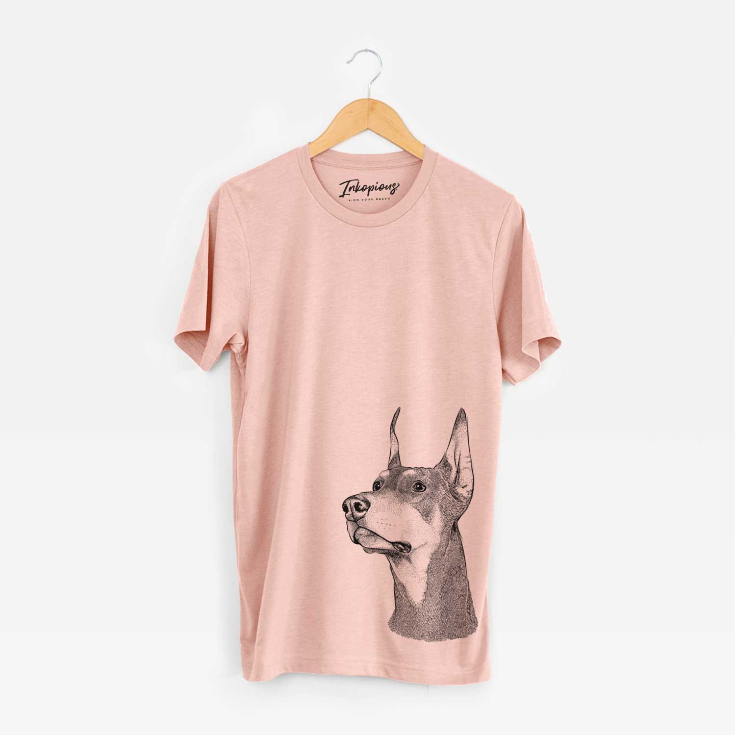 Hand-drawn sketch of Cenza the Doberman Pinscher on a Peach Bella Canvas Unisex Crewneck