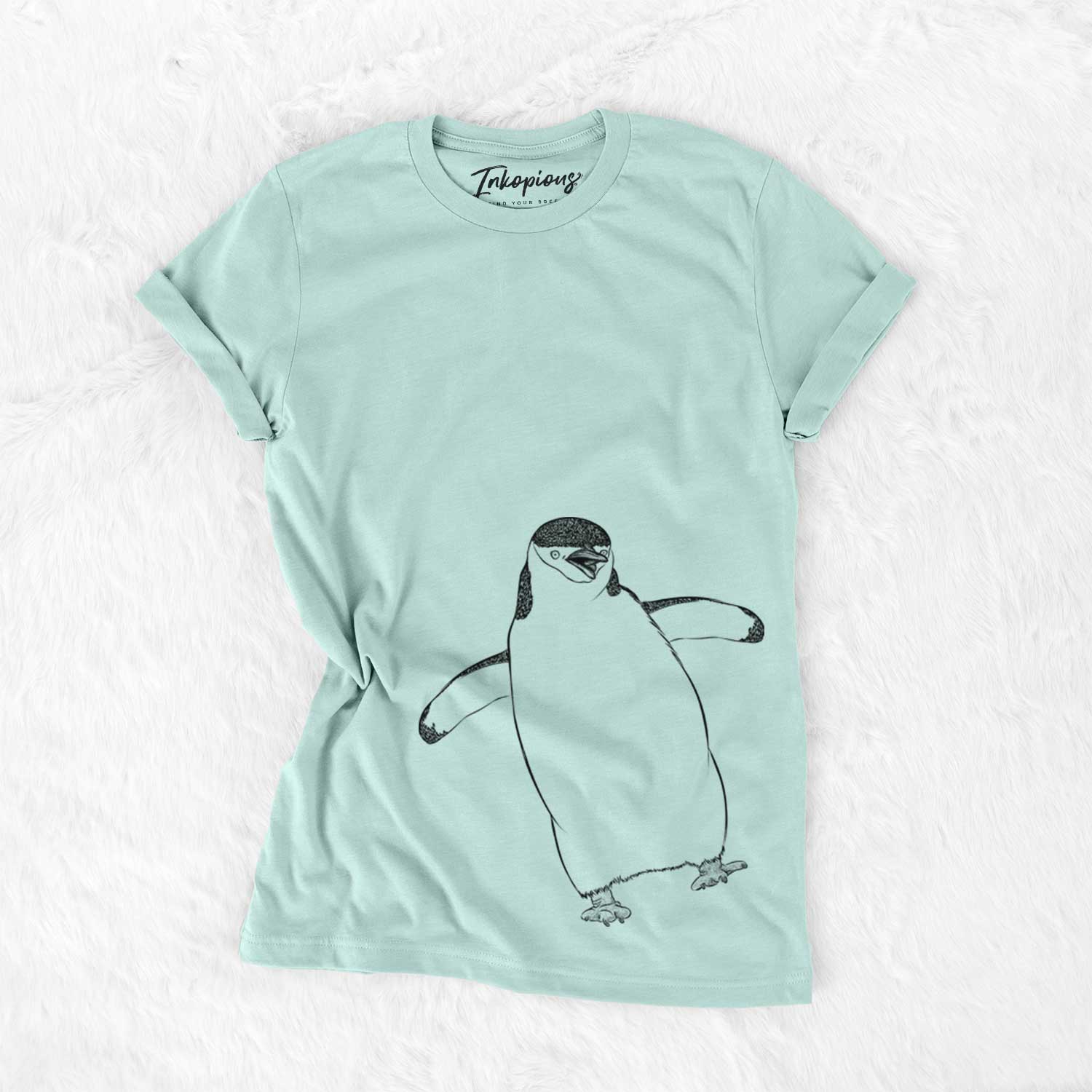 Hand-drawn sketch of Chive the Chinstrap Penguin on a Heather Sage Bella Canvas Unisex Crewneck
