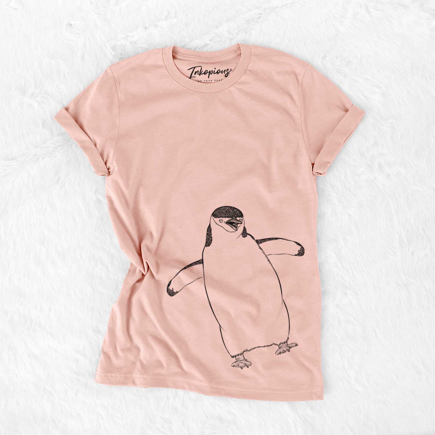 Hand-drawn sketch of Chive the Chinstrap Penguin on a Peach Bella Canvas Unisex Crewneck
