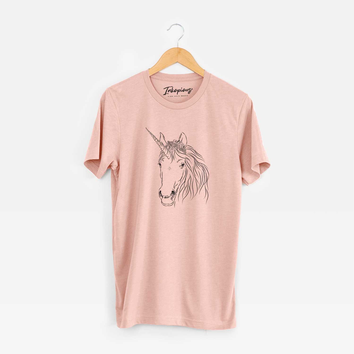 Hand-drawn sketch of Cosmic the Unicorn on a Peach Unisex crewneck