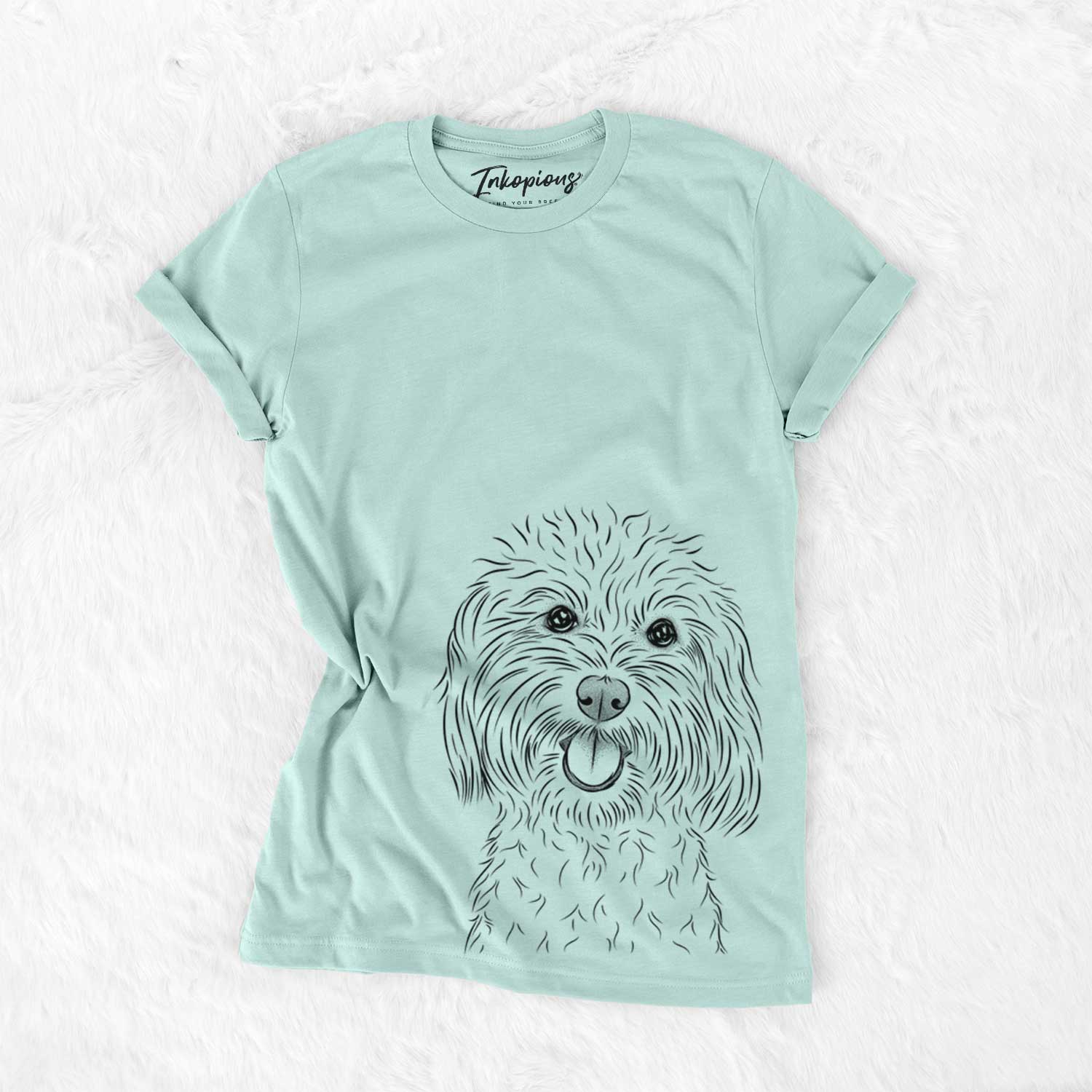 Hand-drawn sketch of Cuddles the Coton de Tulear on a Heather Sage Unisex crewneck