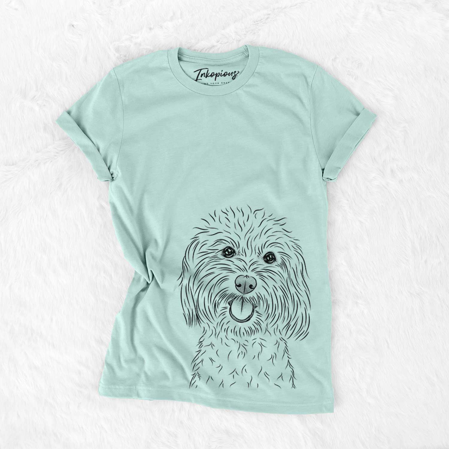 Hand-drawn sketch of Cuddles the Coton de Tulear on a Heather Sage Bella Canvas Unisex Crewneck