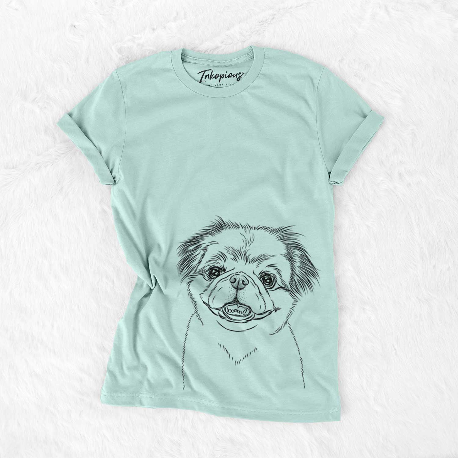 Hand-drawn sketch of Danny the Pekingese on a Heather Sage Unisex crewneck