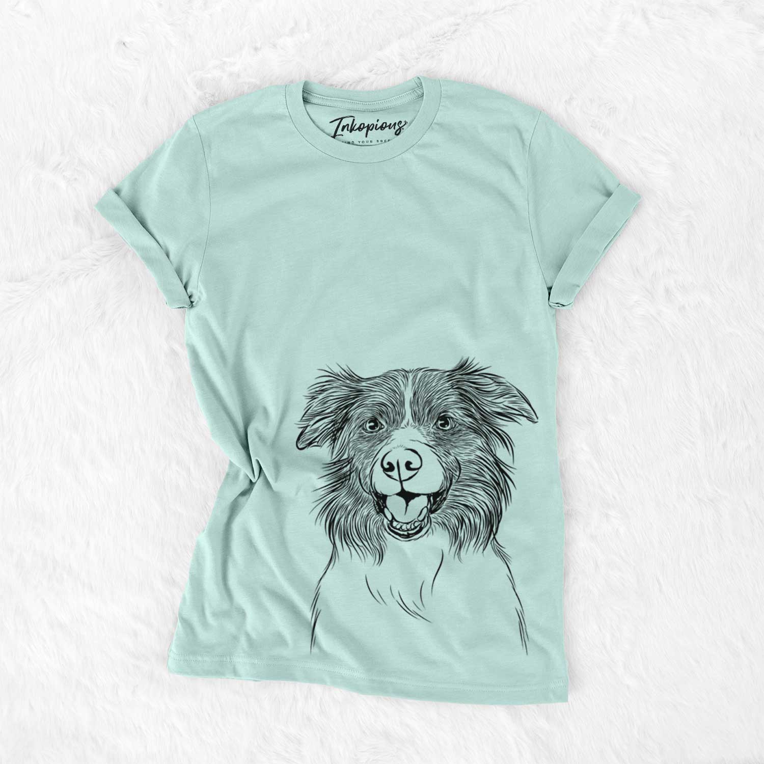 Hand-drawn sketch of Dizzy the Border Collie on a Heather Sage Unisex crewneck