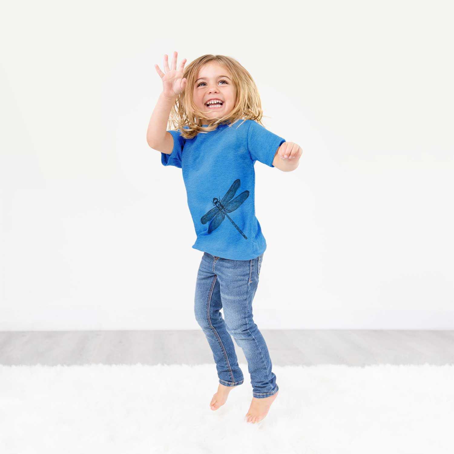 Hand-drawn sketch of a Dragonfly on an All Kids kids' shirt