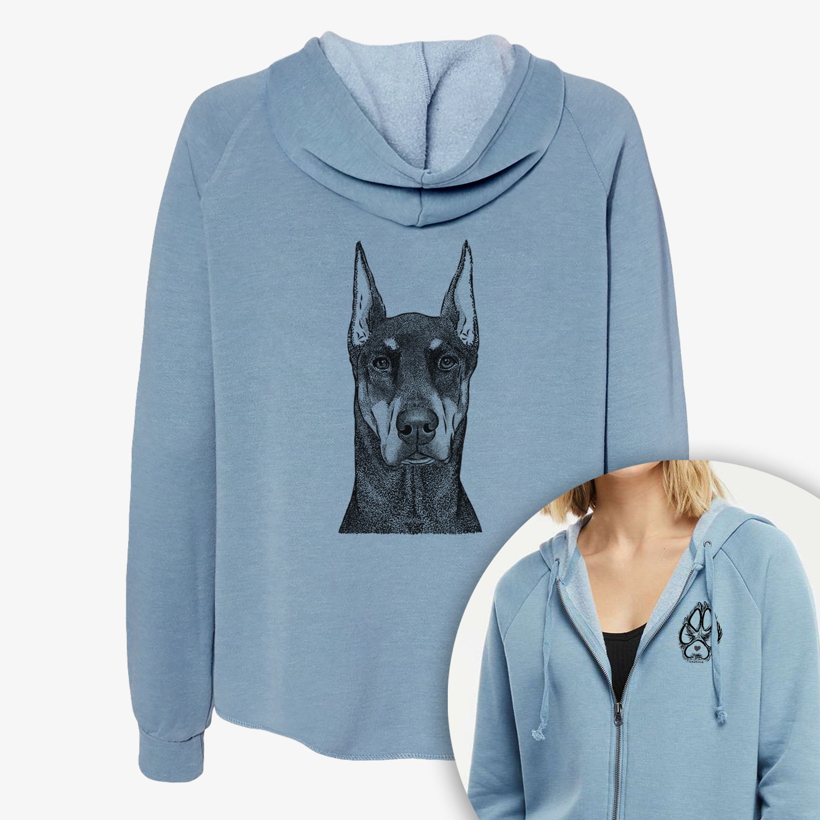 Hand-drawn sketch of Drake the Doberman Pinscher on a Women's cali wave zip-up sweatshirt, shown with icons of the other available costume styles