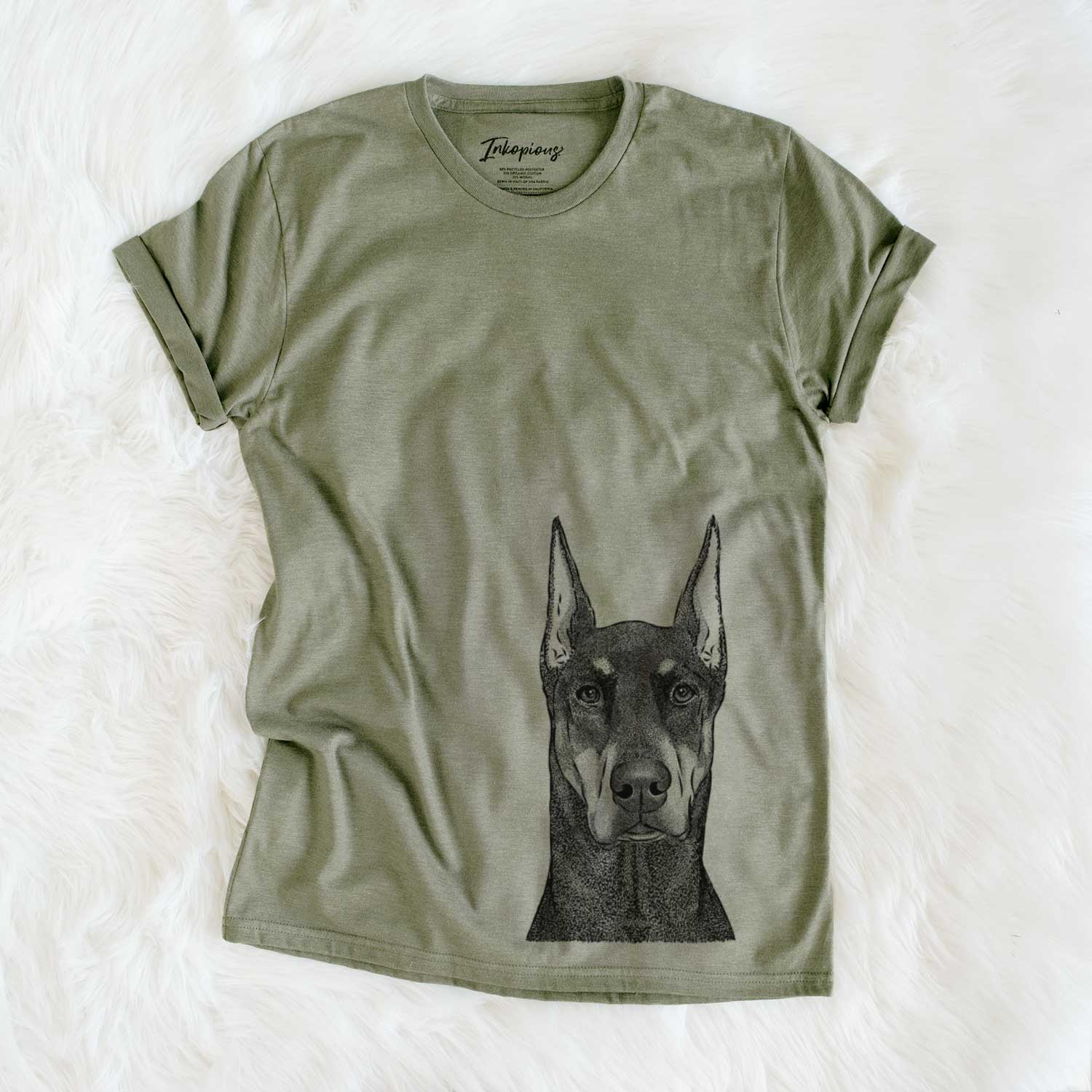Hand-drawn sketch of Drake the Doberman Pinscher on an Olive Unisex crewneck
