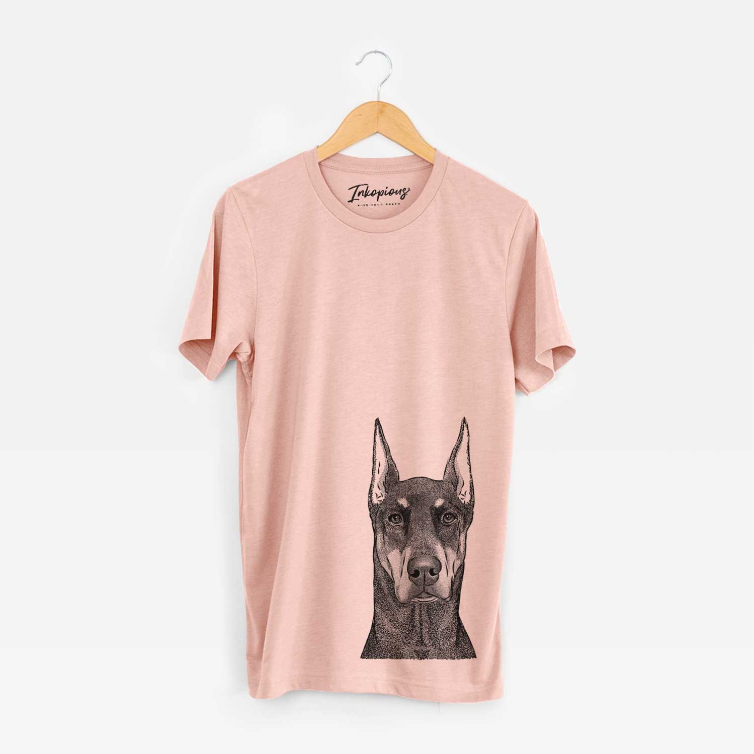 Hand-drawn sketch of Drake the Doberman Pinscher on a Peach Unisex crewneck