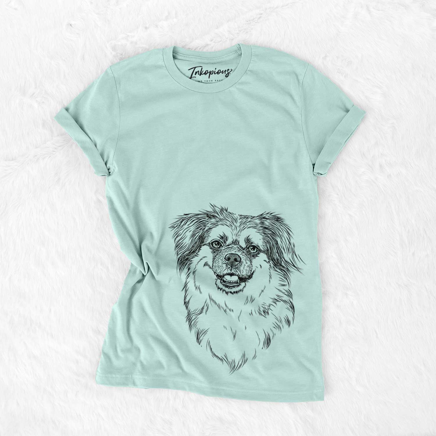 Hand-drawn sketch of Ed the Tibetan Spaniel on a Heather Sage Unisex crewneck