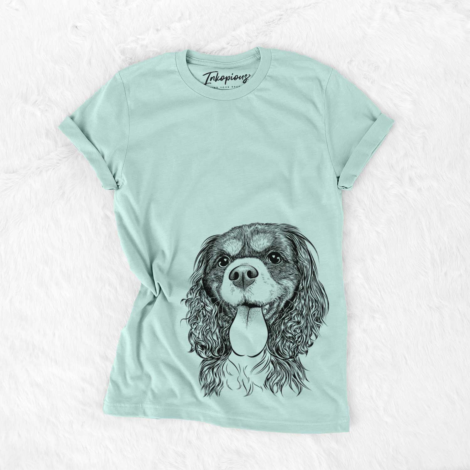 Hand-drawn sketch of Elizabeth the Cavalier King Charles Spaniel on a Heather Sage Bella Canvas Unisex Crewneck