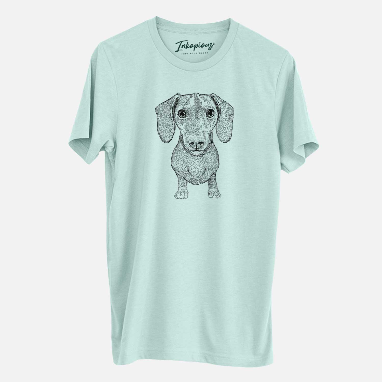 Hand-drawn sketch of Ernie the Mini Dachshund on a Heather Sage Unisex crewneck