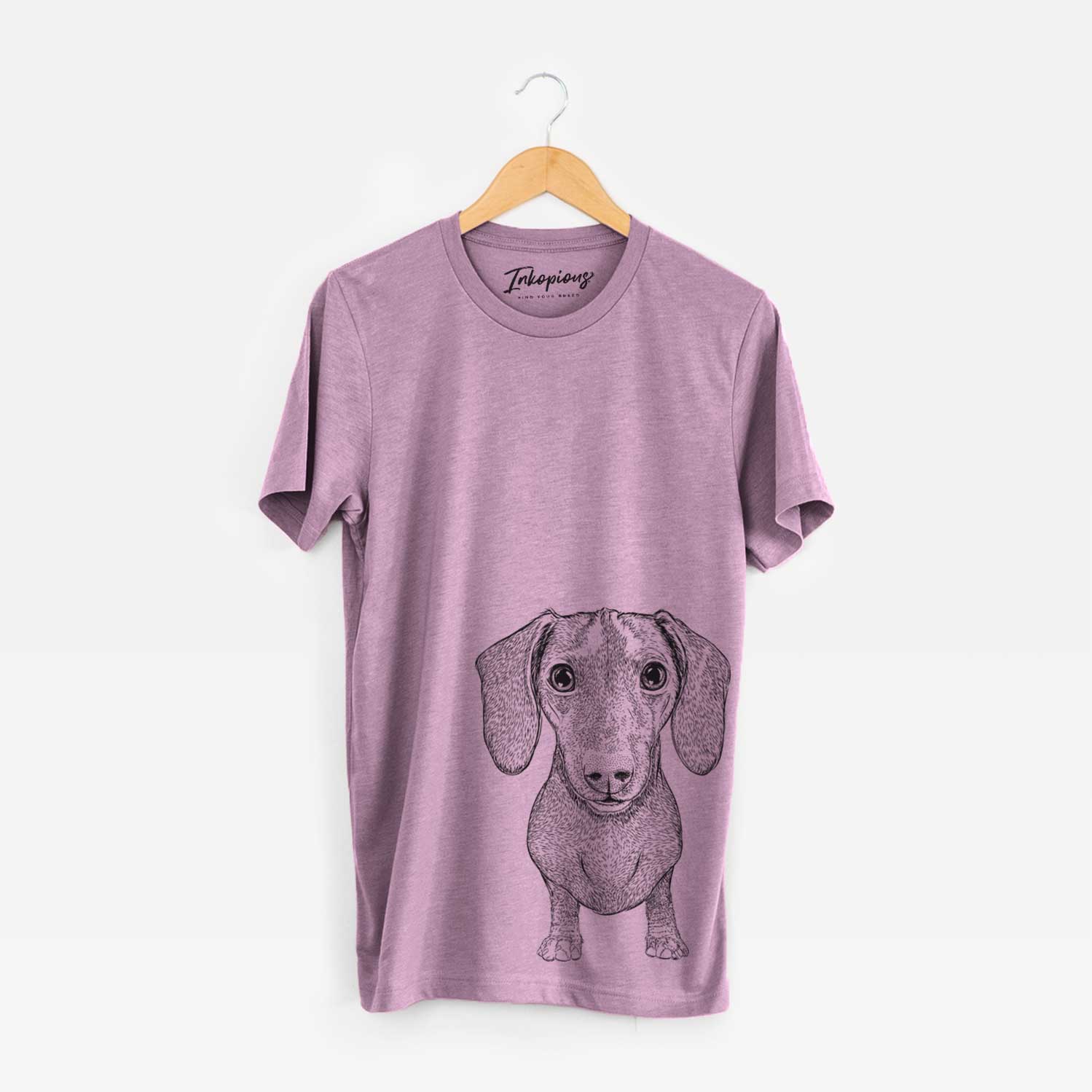 Hand-drawn sketch of Ernie the Mini Dachshund on an Orchid Unisex crewneck