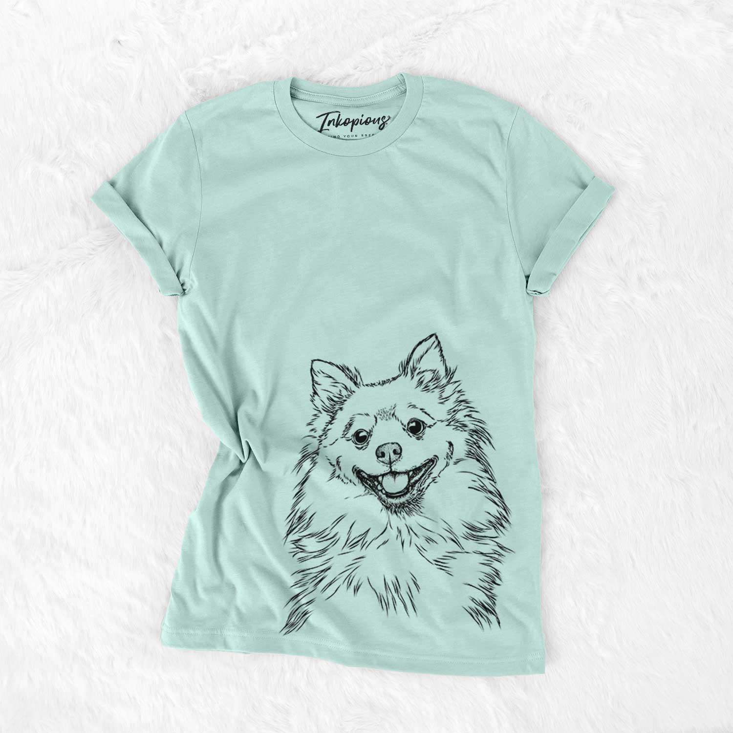 Hand-drawn sketch of Fibi the Spitz on a Heather Sage Bella Canvas Unisex Crewneck
