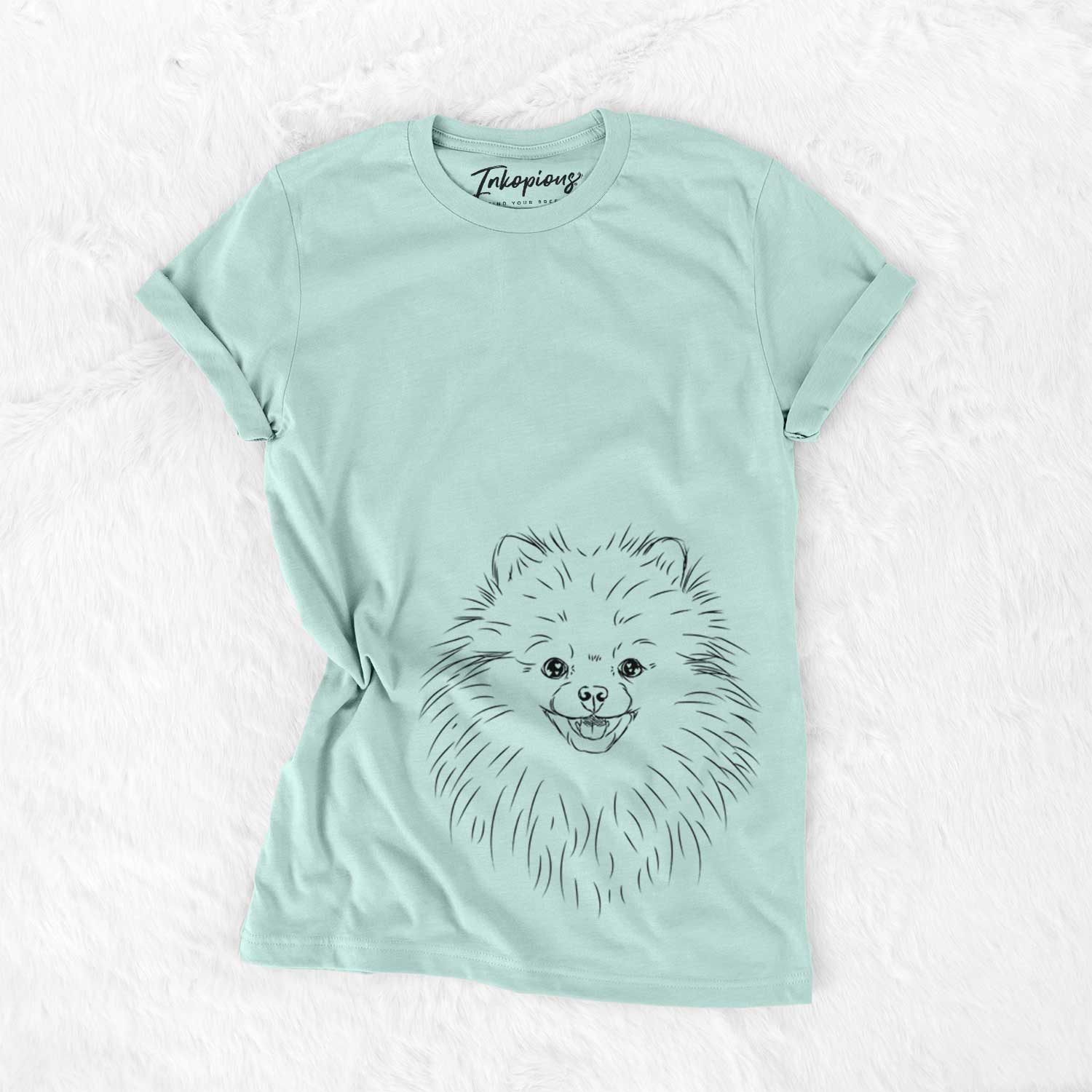 Hand-drawn sketch of Finn the Pomeranian on a Heather Sage Bella Canvas Unisex Crewneck