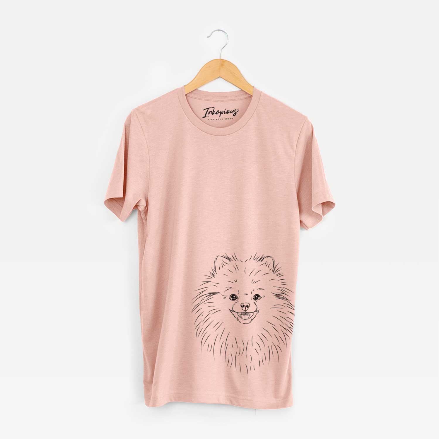 Hand-drawn sketch of Finn the Pomeranian on a Peach Bella Canvas Unisex Crewneck