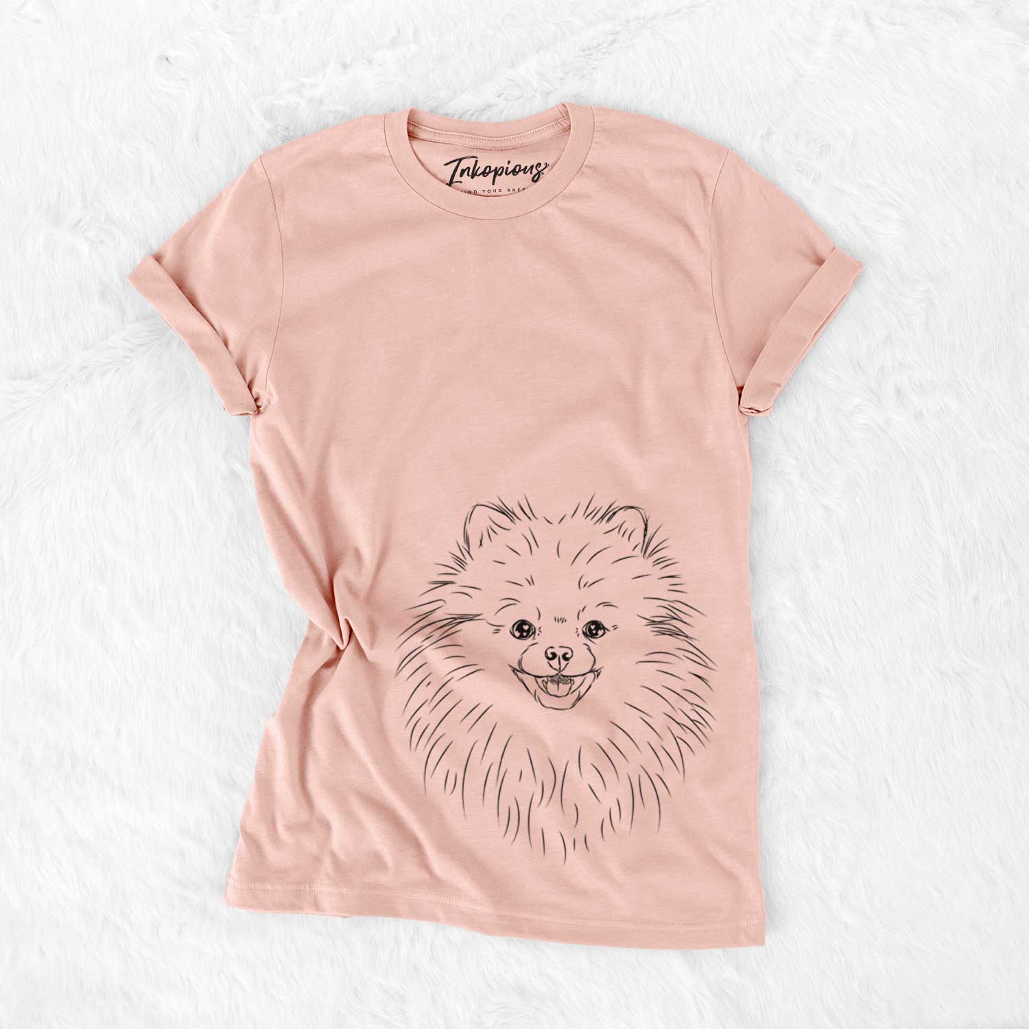Hand-drawn sketch of Finn the Pomeranian on a Peach Bella Canvas Unisex Crewneck