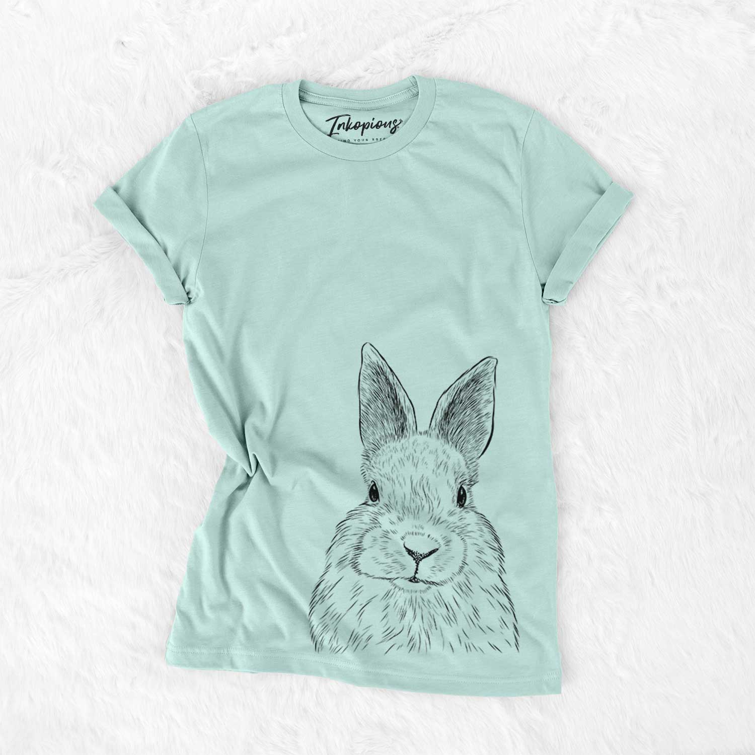 Hand-drawn sketch of Flower the Rex Rabbit on a Heather Sage Bella Canvas Unisex Crewneck