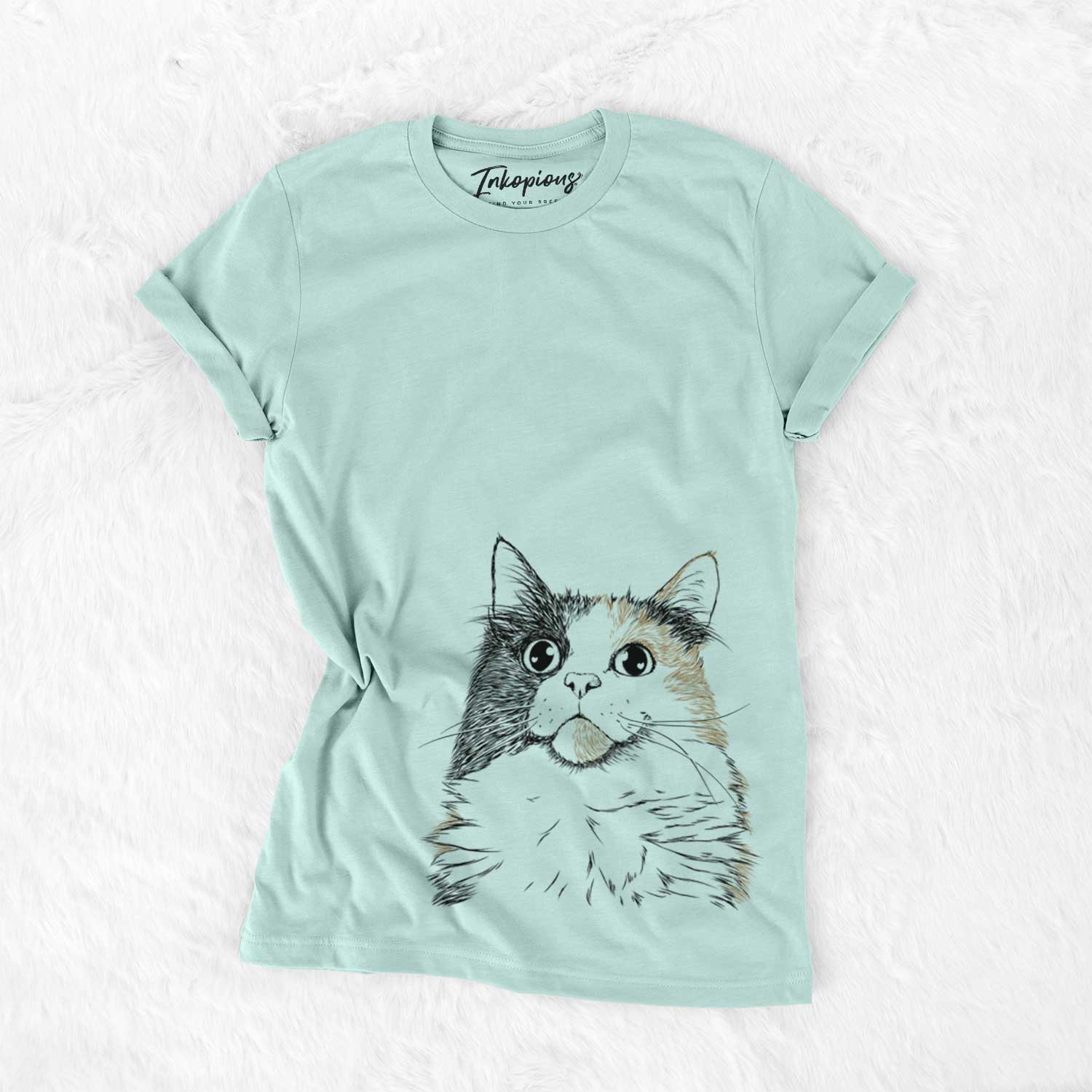 Hand-drawn sketch of Greta the Calico Cat on a Heather Sage Bella Canvas Unisex Crewneck
