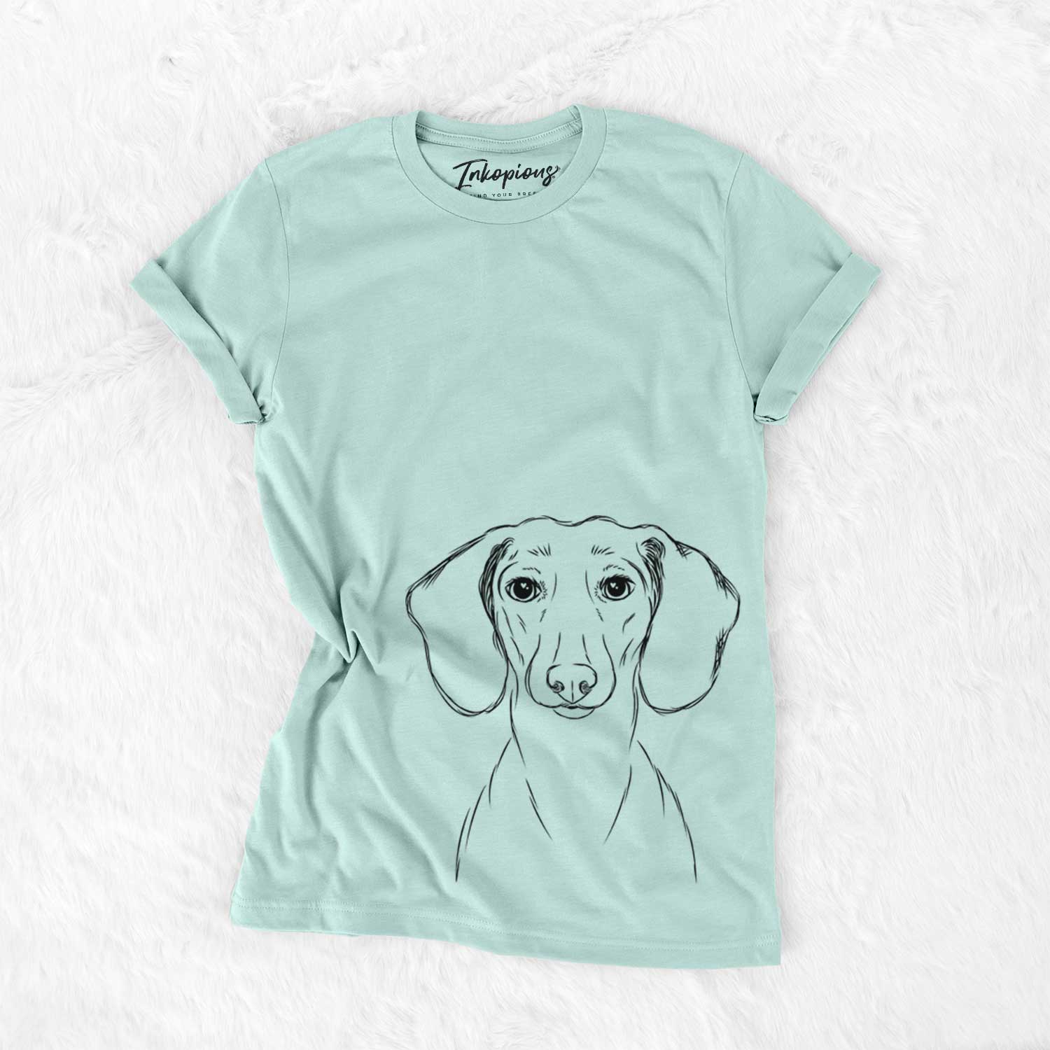 Hand-drawn sketch of Hans the Dachshund on a Heather Sage Unisex crewneck