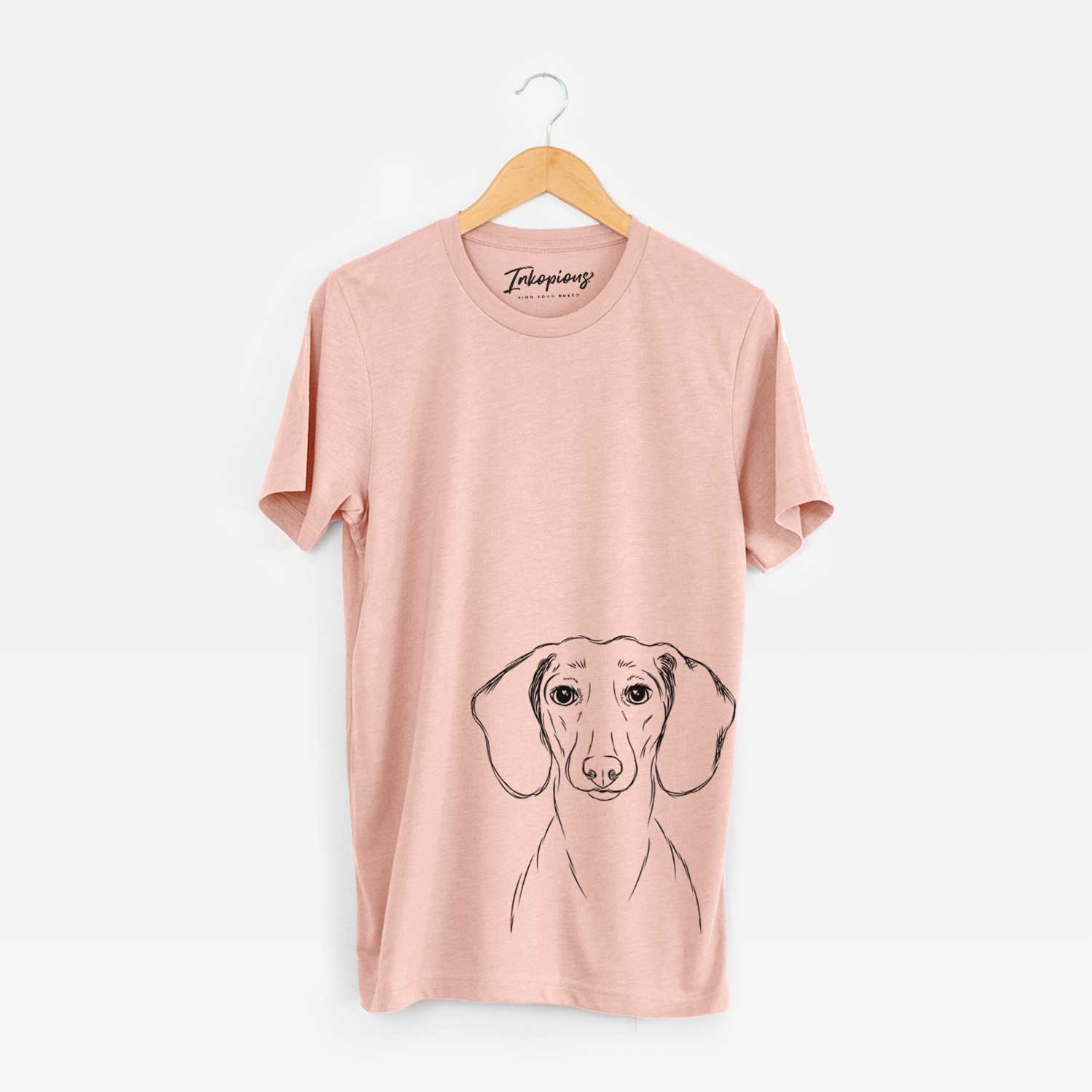 Hand-drawn sketch of Hans the Dachshund on a Peach Unisex crewneck
