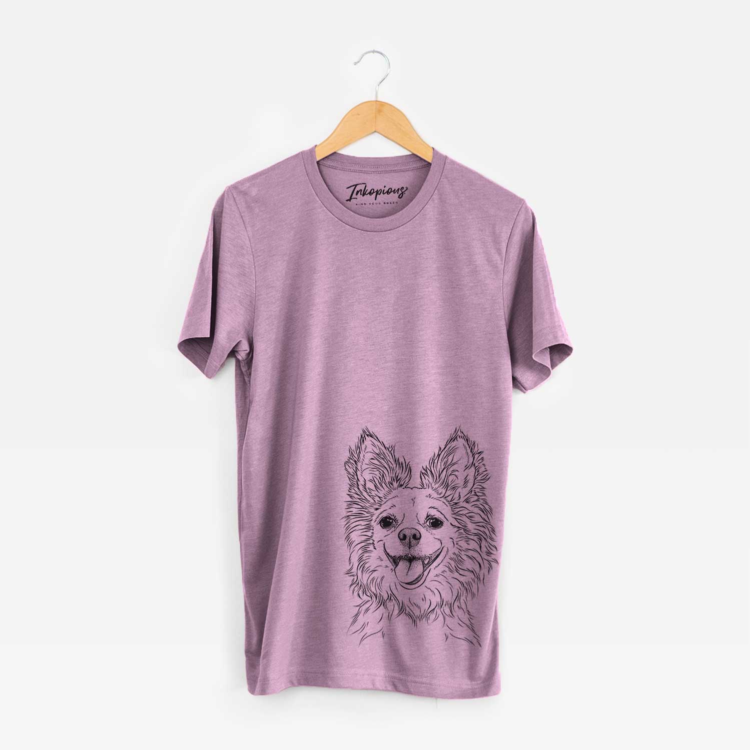 Hand-drawn sketch of Jasper the Pomchi on an Orchid Unisex crewneck