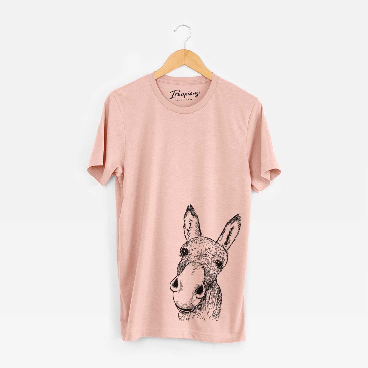 Hand-drawn sketch of Jenny the Donkey on a Peach Bella Canvas Unisex Crewneck