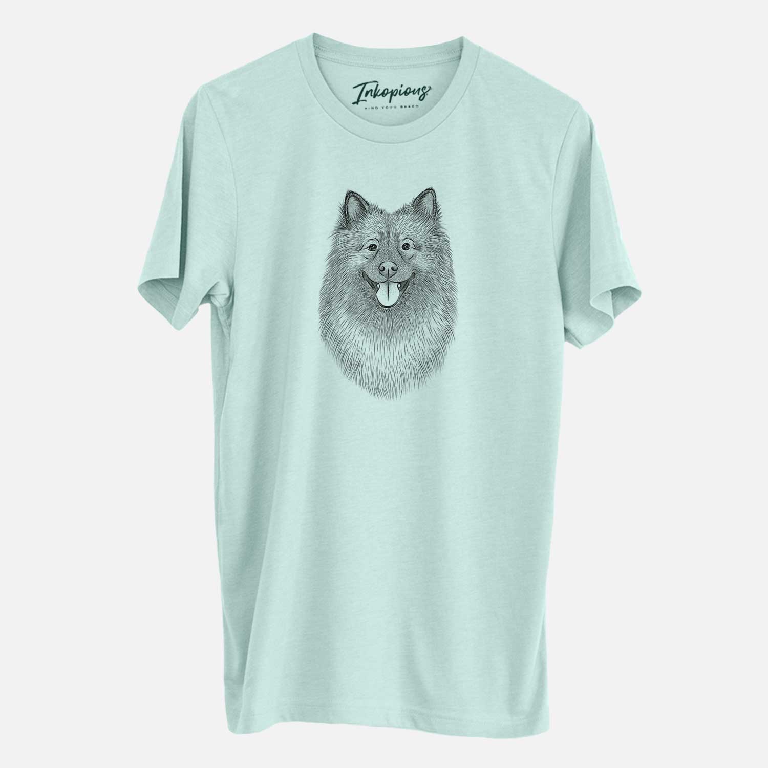 Hand-drawn sketch of Kai the Keeshond on a Heather Sage Unisex crewneck