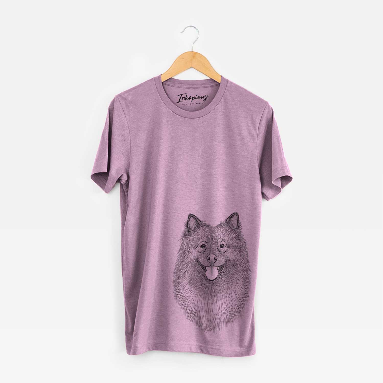 Hand-drawn sketch of Kai the Keeshond on an Orchid Unisex crewneck