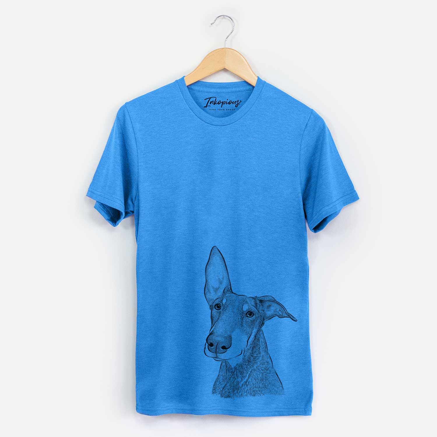 Hand-drawn sketch of Kain the Doberman Pinscher on a Blue Unisex crewneck