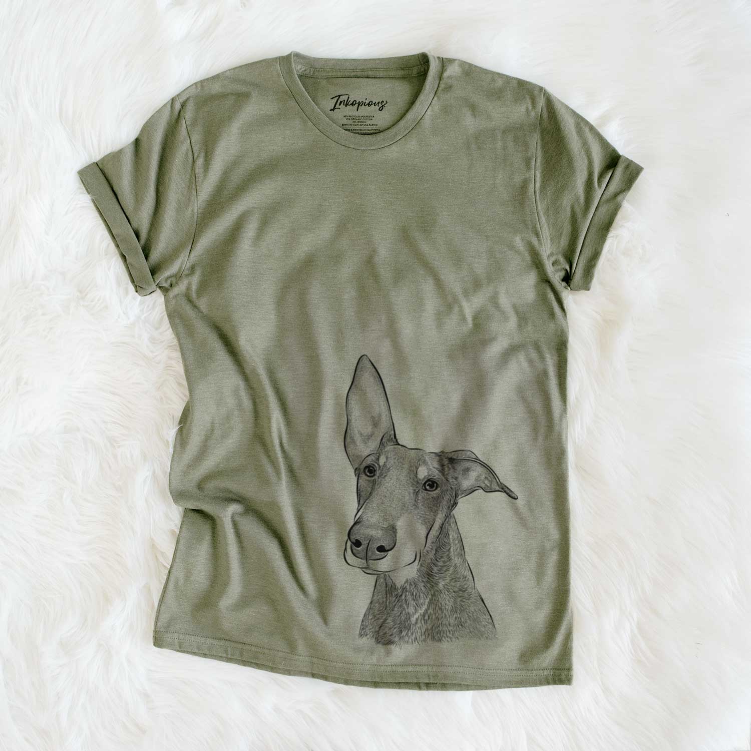 Hand-drawn sketch of Kain the Doberman Pinscher on an Olive Unisex crewneck