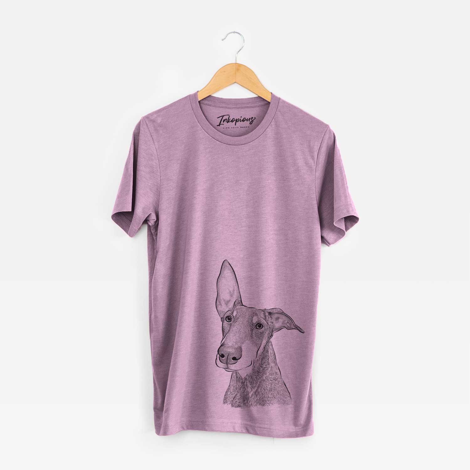 Hand-drawn sketch of Kain the Doberman Pinscher on an Orchid Unisex crewneck