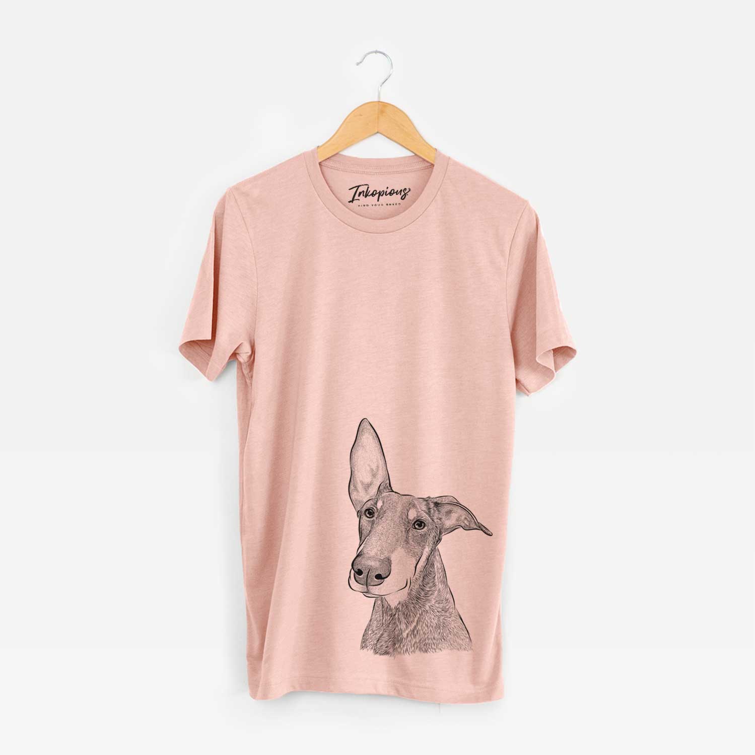 Hand-drawn sketch of Kain the Doberman Pinscher on a Peach Bella Canvas Unisex Crewneck
