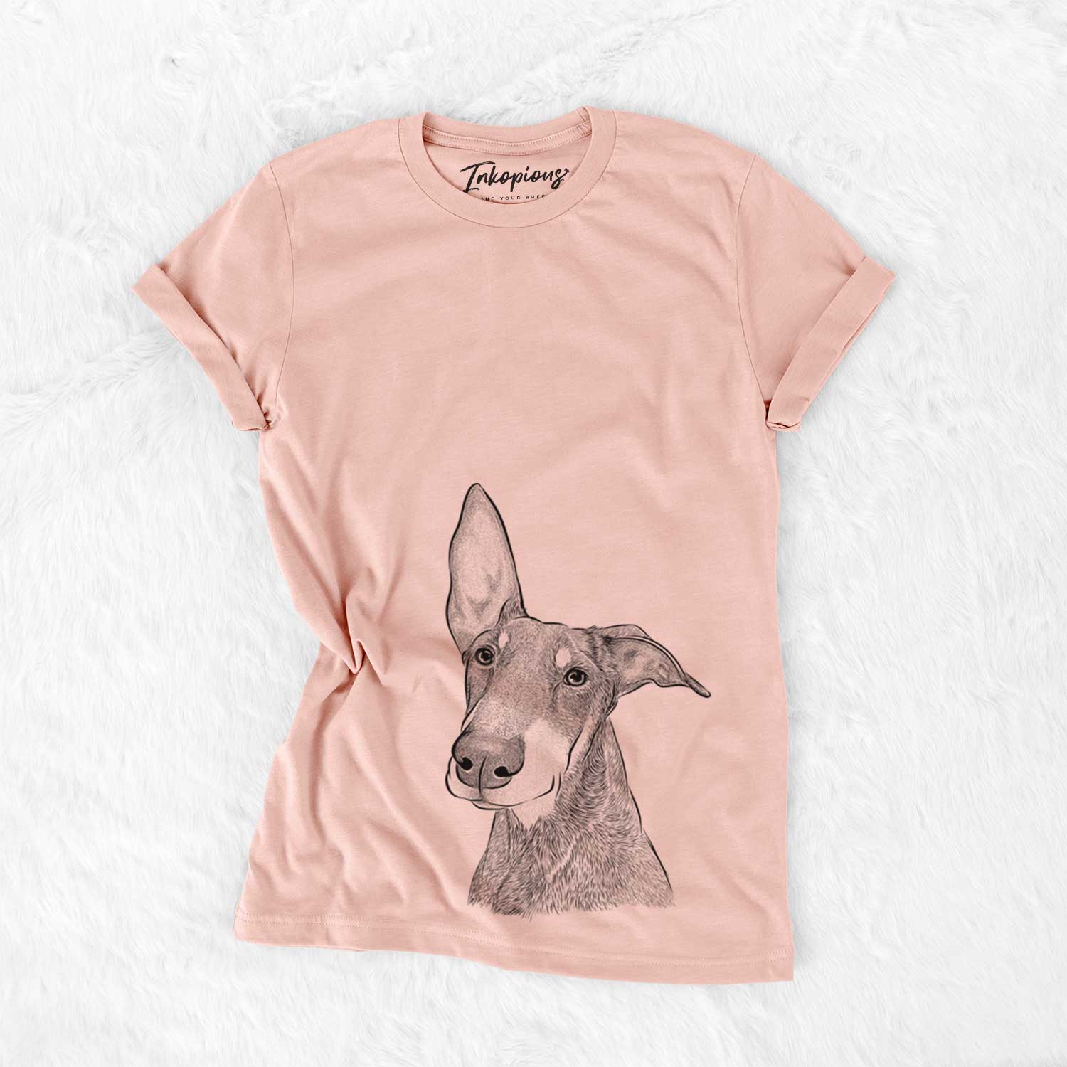 Hand-drawn sketch of Kain the Doberman Pinscher on a Peach Bella Canvas Unisex Crewneck
