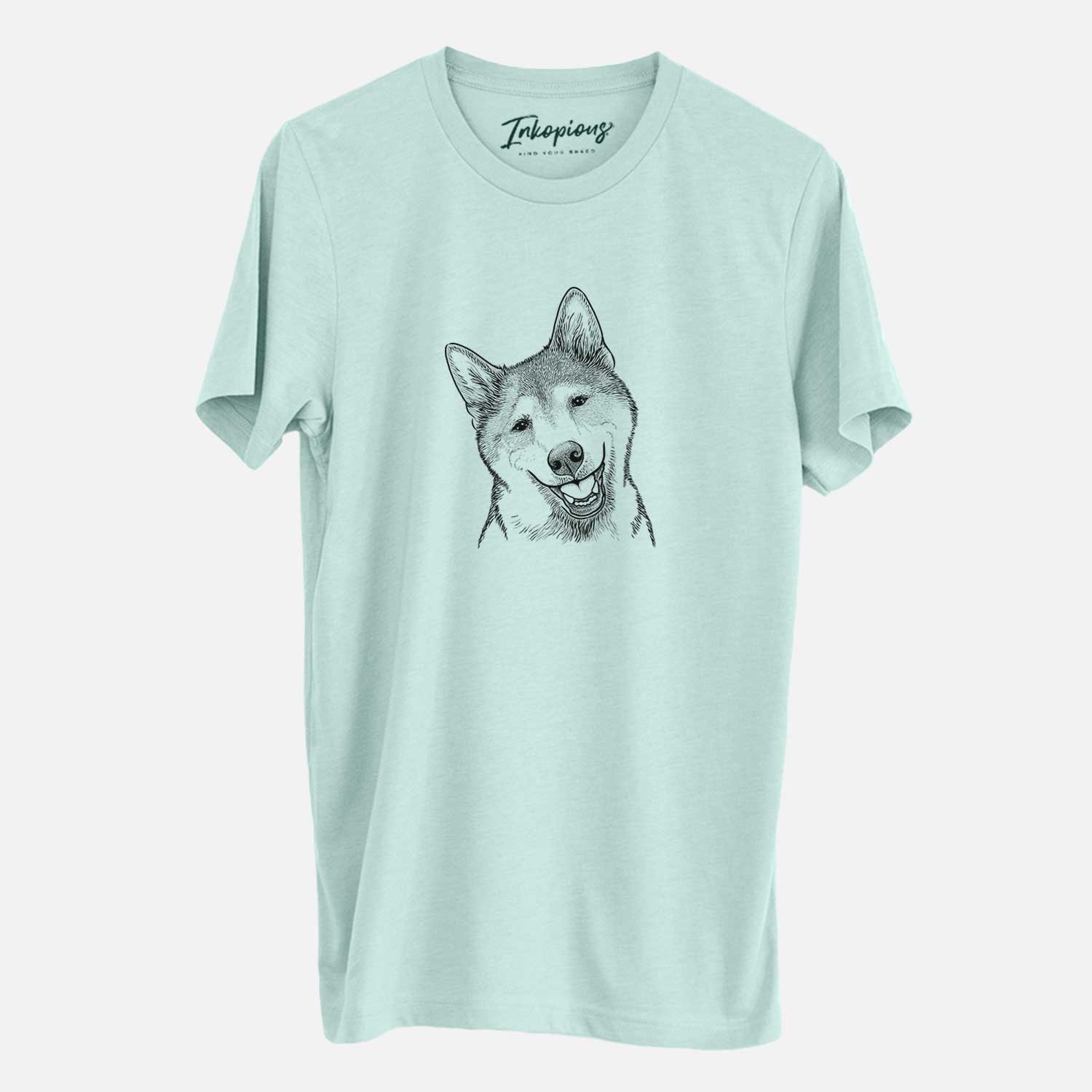 Hand-drawn sketch of Koby the Shiba Inu on a Heather Sage Unisex crewneck